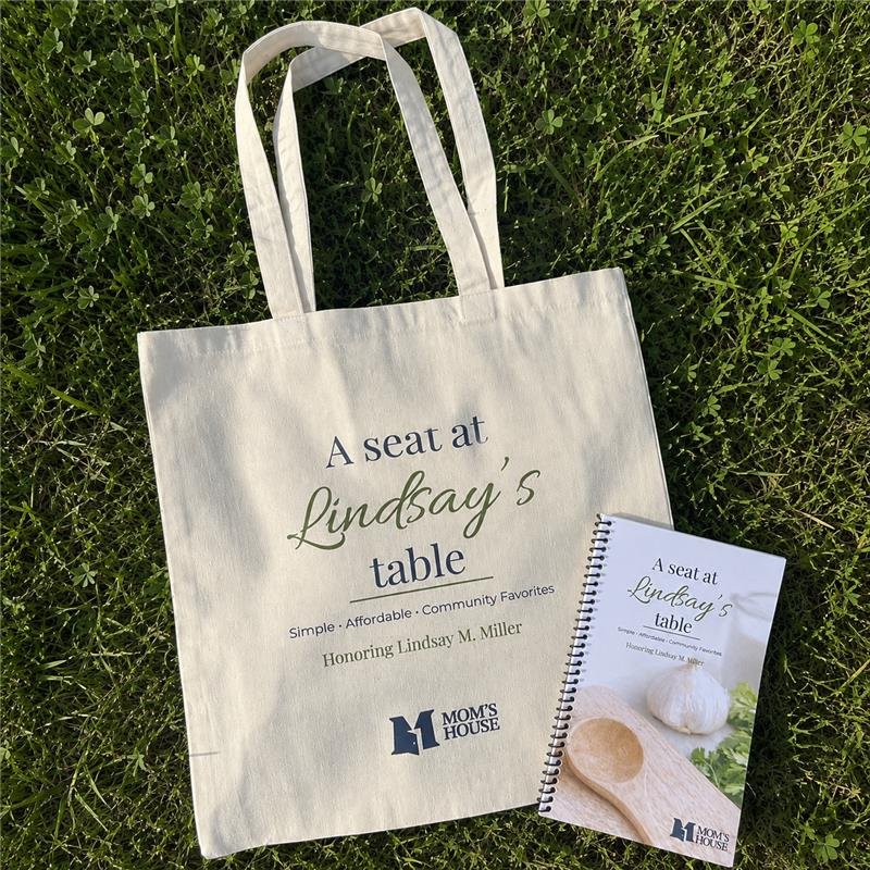 Canvas tote printed with the cookbook title, beside the cookbook
